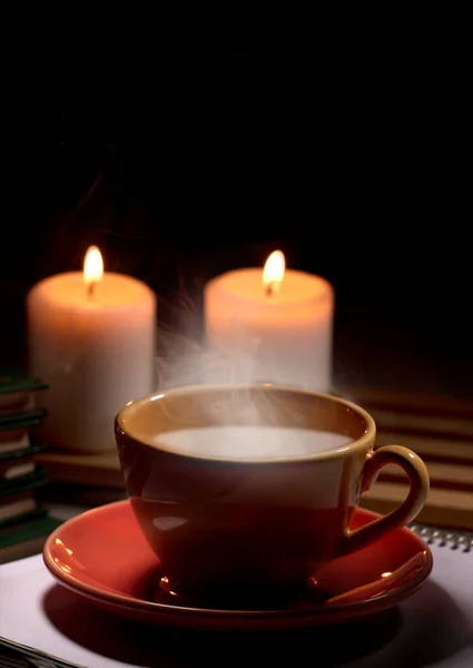 Hot Yellow Mug Drink Steam Two Burning Candles Together Table — Stock Photo, Image