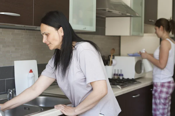 Two women cleaning the furniture — Stock Photo, Image