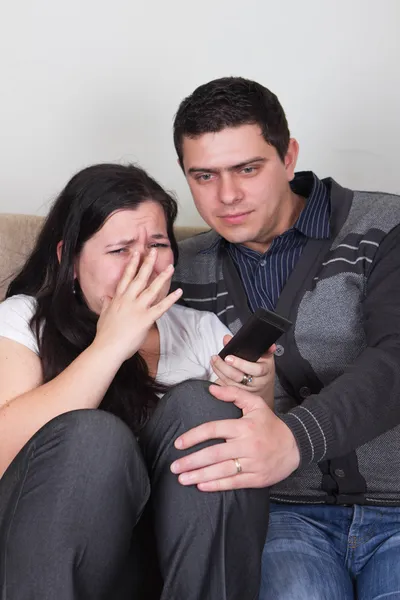 Young couple watching TV at home — Stock Photo, Image