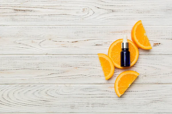 배경에는 오렌지 열매로 필수적 기름이 의학의 위에서 복제품 — 스톡 사진