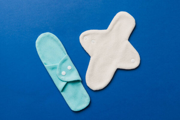 Eco-friendly reusable fabric women's pads. set of colorful bright reusable menstrual pads. zero waste woman periods concept top view with copy space.