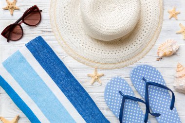 Summer vacation concept flat lay. beach accessories and towel top view. Space for text. travel concept.