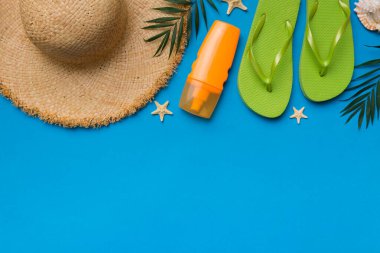 Summer vacation concept flat lay. straw hat beach accessories and towel top view. Space for text. travel concept.