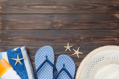 Summer vacation concept flat lay. straw hat beach accessories and towel top view. Space for text. travel concept.