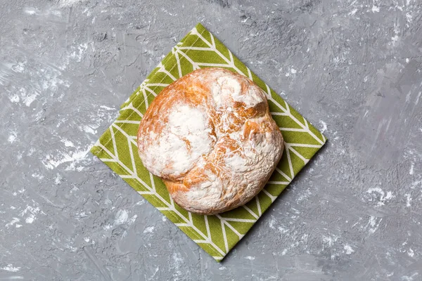 Fresh homemade crisp round bread on napkin, top view. Healthy unleavened bread. French bread. Top view Bakery products.