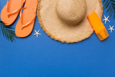 Summer vacation concept flat lay. straw hat beach accessories and towel top view. Space for text. travel concept.