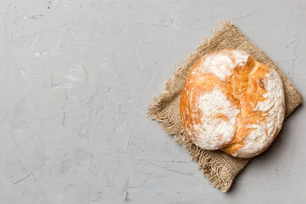 Fresh homemade crisp round bread on napkin, top view. Healthy unleavened bread. French bread. Top view Bakery products.