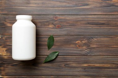 İlaçlar, ilaç şişesi, sağlık ve tıbbi destek. Vitamin hapları. Yeşil yapraklı vitaminler, doğal organik biyo takviyeler, fotokopi alanı..