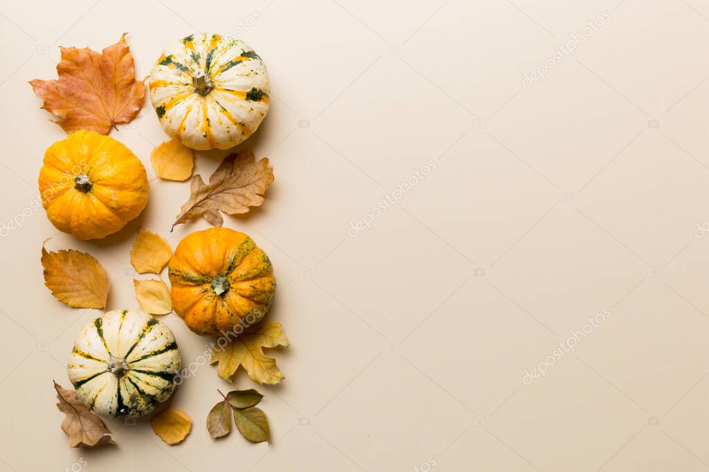 Autumn composition. Pattern made of dried leaves and other design accessories on table. Flat lay, top view.