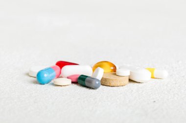 Many different colorful medication and pills perspective view. Set of many pills on colored background.