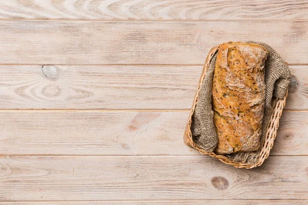 Freshly baked bread on basket against natural background. top view bread copy space.