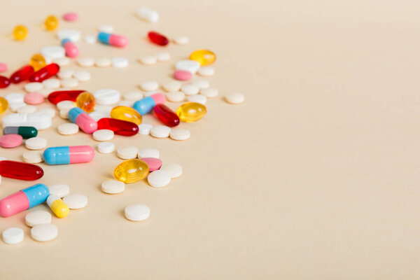 Many different colorful medication and pills perspective view. Set of many pills on colored background.