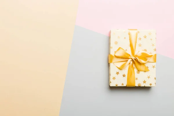 Holiday Paper Present Tied Yellow Ribbon Bow Top View Copy — Stok fotoğraf