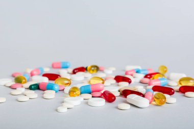 Many different colorful medication and pills perspective view. Set of many pills on colored background.