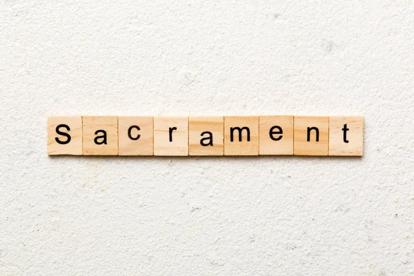 Sacrament Kelime Ahşap Blok Üzerinde Yazılı Sacrament Metin Tablo Kavram — Stok fotoğraf