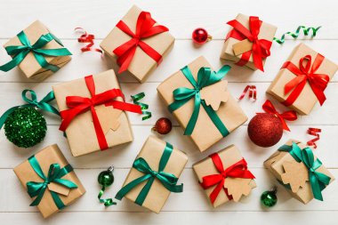 Colored craft gift boxes with colorful ribbons on colored background. Collection of Christmas present boxes .