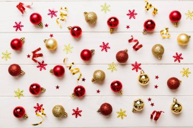 Christmas composition. a pattern of christmas balls on colored background. Flat lay, top view New year decor.