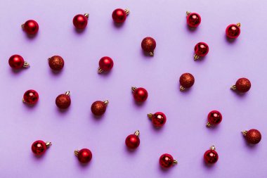 Christmas composition. a pattern of christmas balls on colored background. Flat lay, top view New year decor.