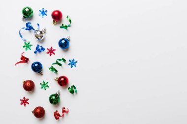Christmas composition. a pattern of christmas balls on colored background. Flat lay, top view New year decor.