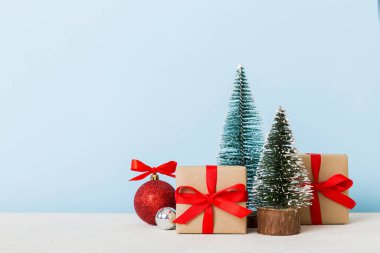 Christmas composition. craft Gift box, small tree, branches and craft DIY decorations on white background. New year concept. Christmas home decoration Flat lay, top view, copy space.