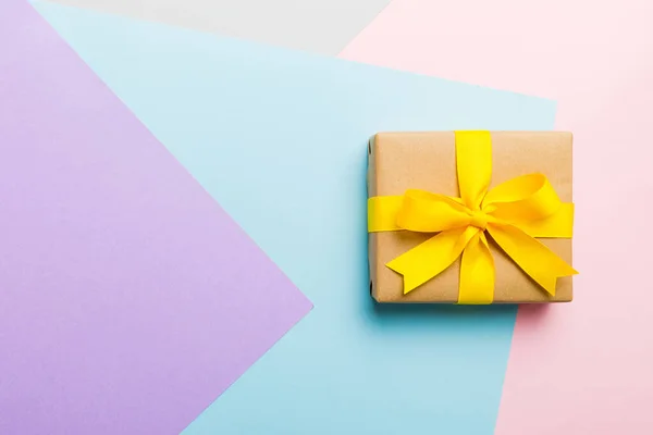 Holiday Paper Present Tied Yellow Ribbon Bow Top View Copy — Stockfoto