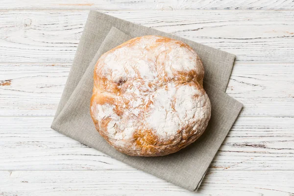 Fresh homemade crisp round bread on napkin, top view. Healthy unleavened bread. French bread. Top view Bakery products.