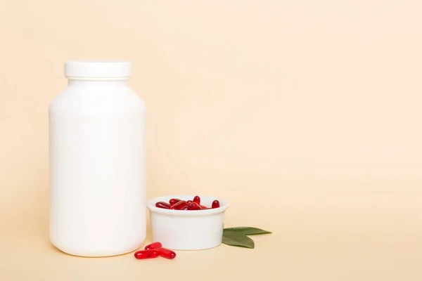 different drugs and health supplement pills with medicine bottle health care and medical top view. Vitamin tablets. Bottle with colored pills on table background. Multivitamins.