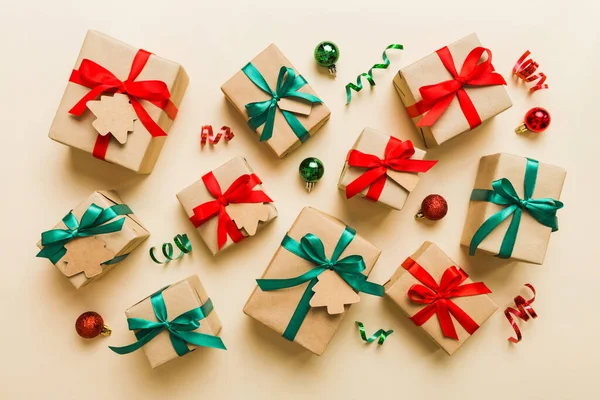 Colored craft gift boxes with colorful ribbons on colored background. Collection of Christmas present boxes .