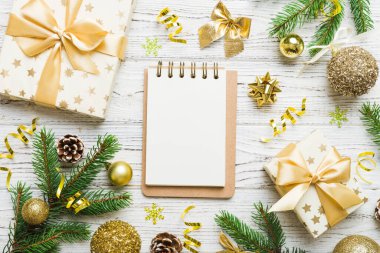 Christmas blank greeting card mock-up scene. Creative layout made of Christmas tree branches and paper card note. Flat lay. Nature New Year concept.