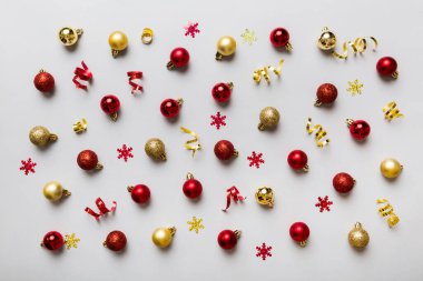 Christmas composition. a pattern of christmas balls on colored background. Flat lay, top view New year decor.