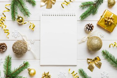 Christmas blank greeting card mock-up scene. Creative layout made of Christmas tree branches and paper card note. Flat lay. Nature New Year concept.