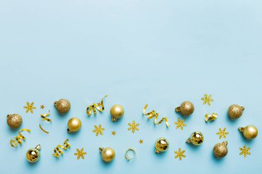 Christmas composition. a pattern of christmas balls on colored background. Flat lay, top view New year decor.