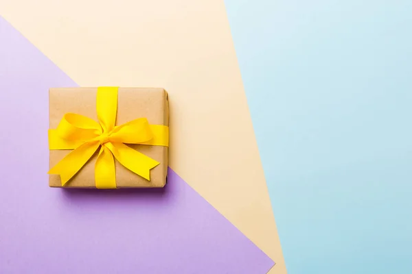 Holiday Paper Present Tied Yellow Ribbon Bow Top View Copy — Foto Stock