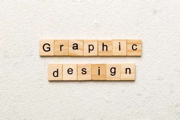 用木块写的平面设计字 为您的设计 概念在水泥桌上的平面设计文字 — 图库照片