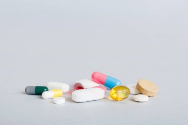 Many different colorful medication and pills perspective view. Set of many pills on colored background.