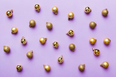 Christmas composition. a pattern of christmas balls on colored background. Flat lay, top view New year decor.
