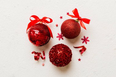 Christmas ball on colored background. decoration bauble with ribbon bow with copy space.