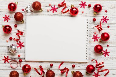 Christmas blank greeting card mock-up scene. Creative layout made of Christmas tree branches and paper card note. Flat lay. Nature New Year concept.