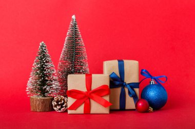 Christmas composition. Gifts, small tree, branches and craft DIY decorations on white background. New year concept. Christmas home decoration Flat lay, top view, copy space.