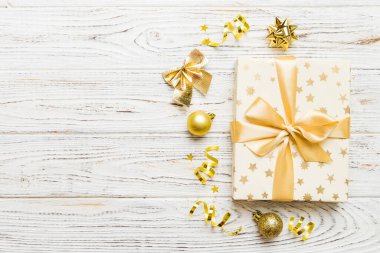 Top view Flat lay Christmas decorations and gift box on colored background with copy space. Christmas or Happy New Year composition.