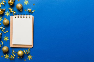 Christmas blank greeting card mock-up scene. Creative layout made of Christmas tree branches and paper card note. Flat lay. Nature New Year concept.