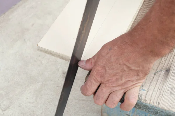 Man Cutting Wooden Board Hand Saw Garden — Stock Photo, Image