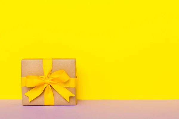 Holiday Paper Present Tied Yellow Ribbon Bow Top View Copy — Stock Photo, Image