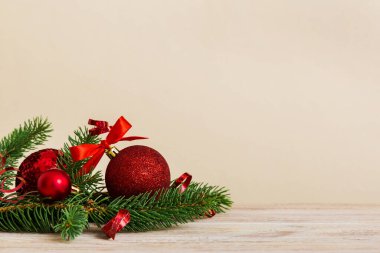 New Year Christmas tree toy, branches of a christmas tree, New Year decorations on a colored background.