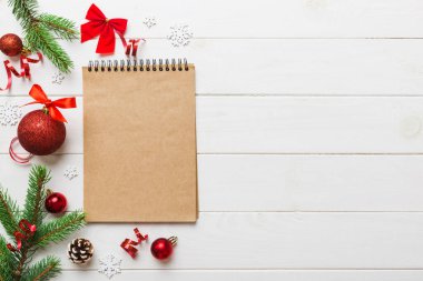 Christmas blank greeting card mock-up scene. Creative layout made of Christmas tree branches and paper card note. Flat lay. Nature New Year concept.