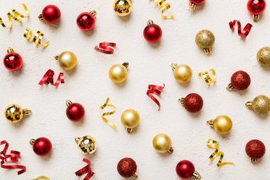 Christmas composition. a pattern of christmas balls on colored background. Flat lay, top view New year decor.