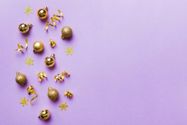 Christmas composition. a pattern of christmas balls on colored background. Flat lay, top view New year decor.