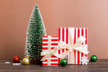 Christmas composition. craft Gift box, small tree, branches and craft DIY decorations on white background. New year concept. Christmas home decoration Flat lay, top view, copy space.
