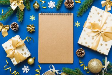 Christmas blank greeting card mock-up scene. Creative layout made of Christmas tree branches and paper card note. Flat lay. Nature New Year concept.