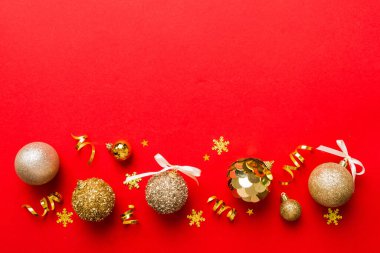 Christmas ball on colored background. decoration bauble with ribbon bow with copy space.